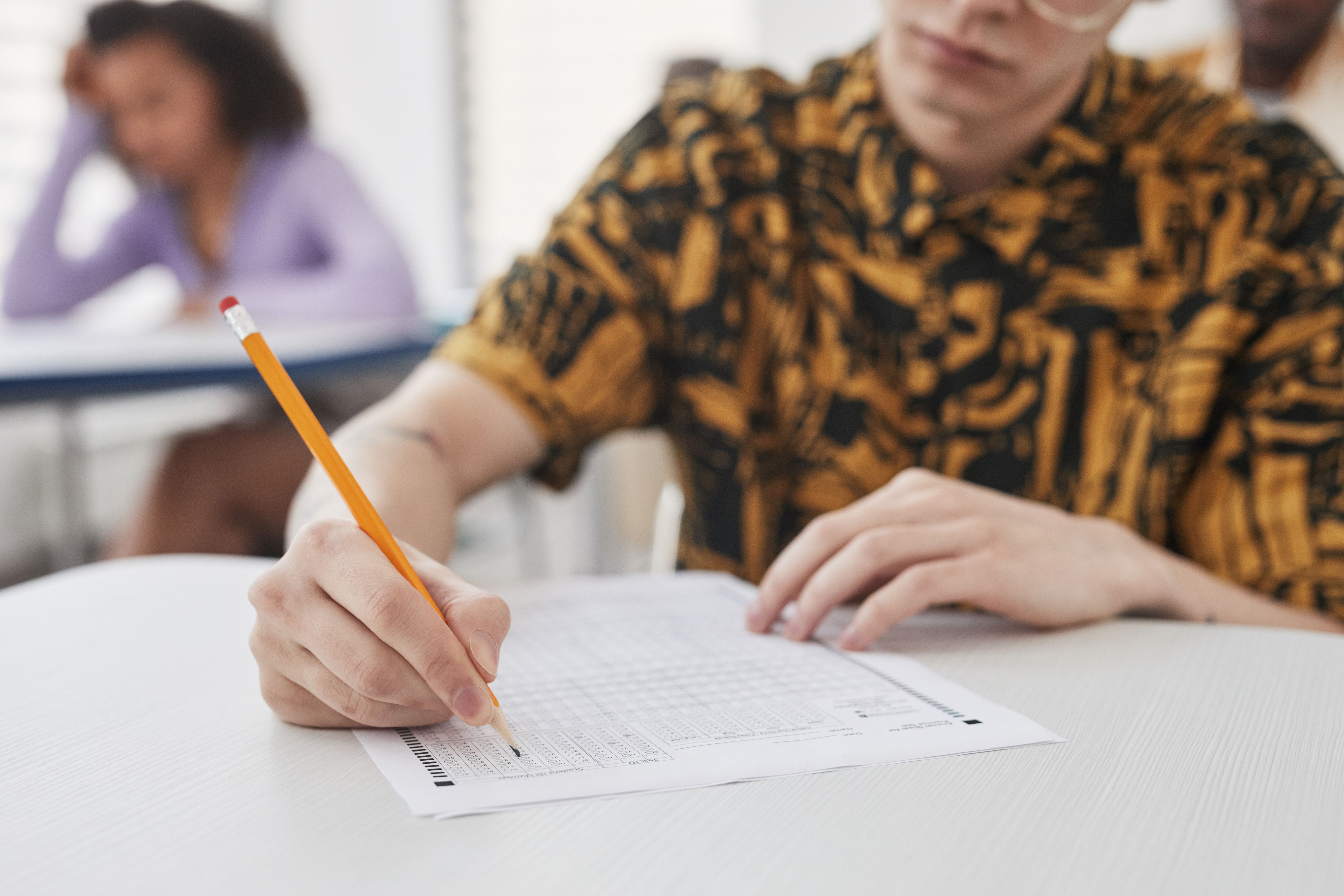 CDL test question count — driver studying multiple choice exam