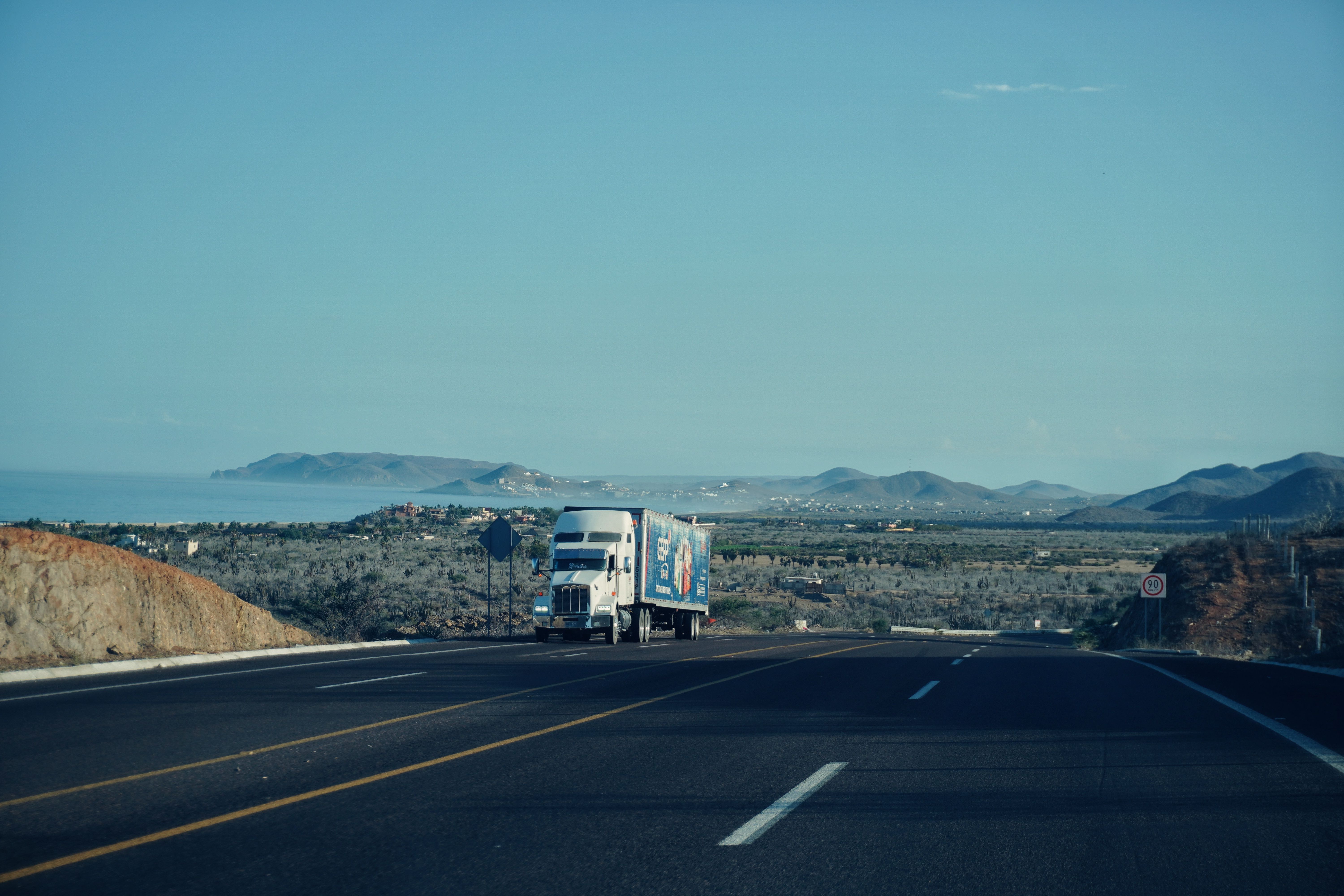 Owner operator vs company driver — semi truck on highway
